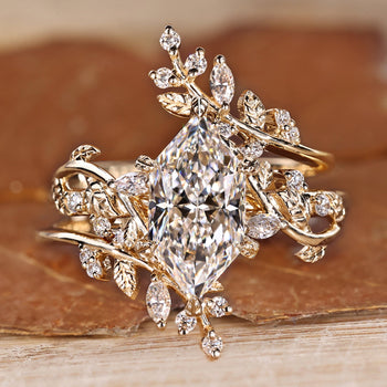 Dutch marquise bridal set with marquise and round side stones.