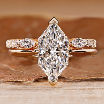 Dutch marquise wedding ring with hidden halo and round accents.
