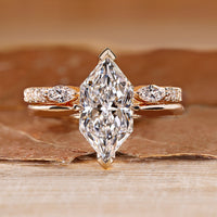 Dutch marquise wedding ring with hidden halo and round accents.