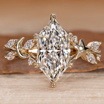 Dutch marquise ring with round side stones.