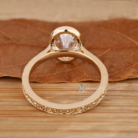 Oval diamond ring with Art Deco cathedral setting.
