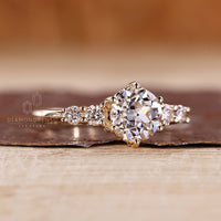 Old european cut diamond ring with six prong and side stones.