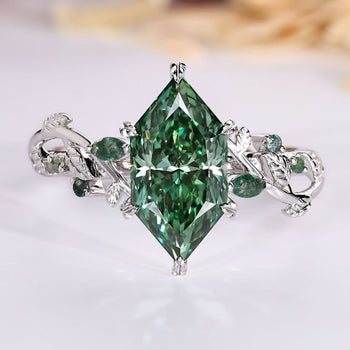 Dutch marquise green diamond ring with moss agate stones.