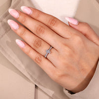 Coffin diamond ring with round diamond pave style details.