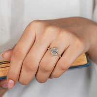 Nature inspired Dutch marquise ring with round diamond side stones.