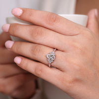 Handmade jewelry pear cut cluster engagement ring design.