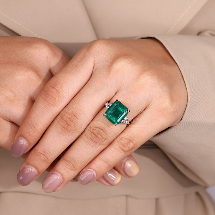 Muse setting emerald engagement ring.