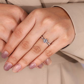 Six claw prong setting ring with round diamond solitaire securely held.