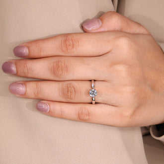 Buy engagement ring with round diamond solitaire in white gold.