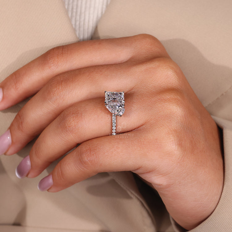 White gold ring featuring a round diamond center stone, perfect for an elegant engagement.