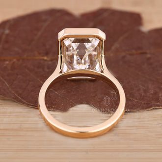 Handmade ring with bezel set diamond.