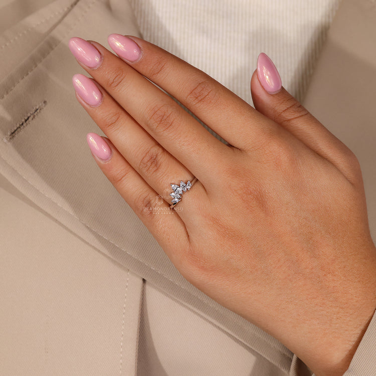 Crown wedding band with delicate diamond accents.