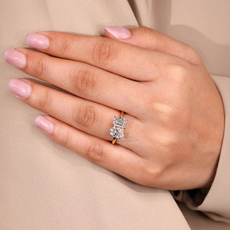 IGI certified handmade ring featuring oval and emerald diamond stones.