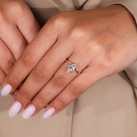 Marquise cut diamond center stone catches the eye.