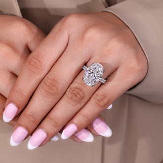 Diamondrensu engagement ring with pave band.