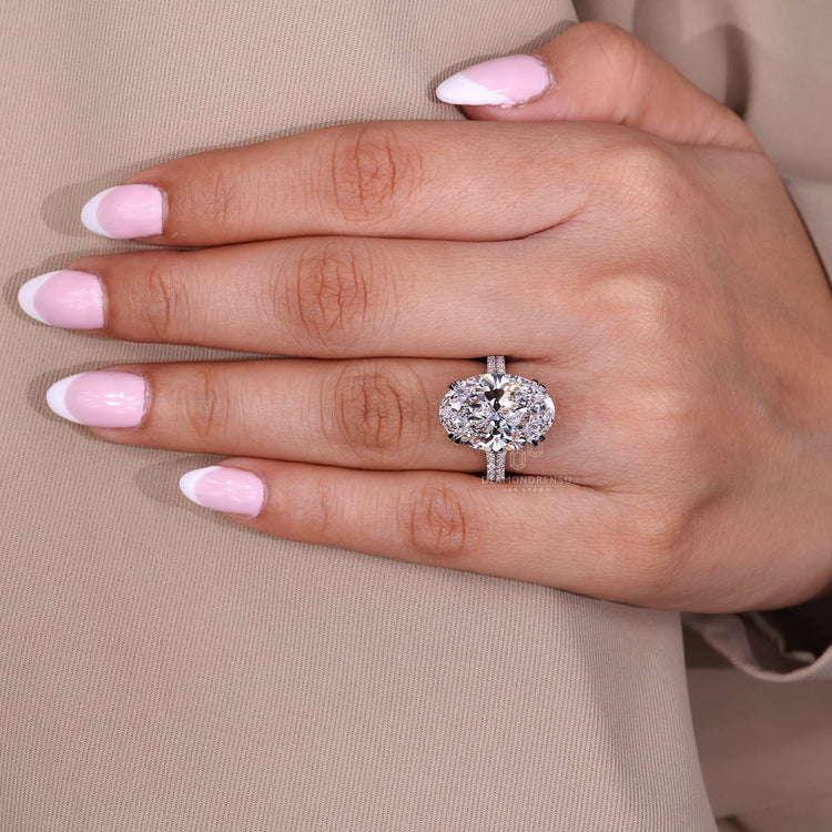 Double claw prong oval diamond ring.