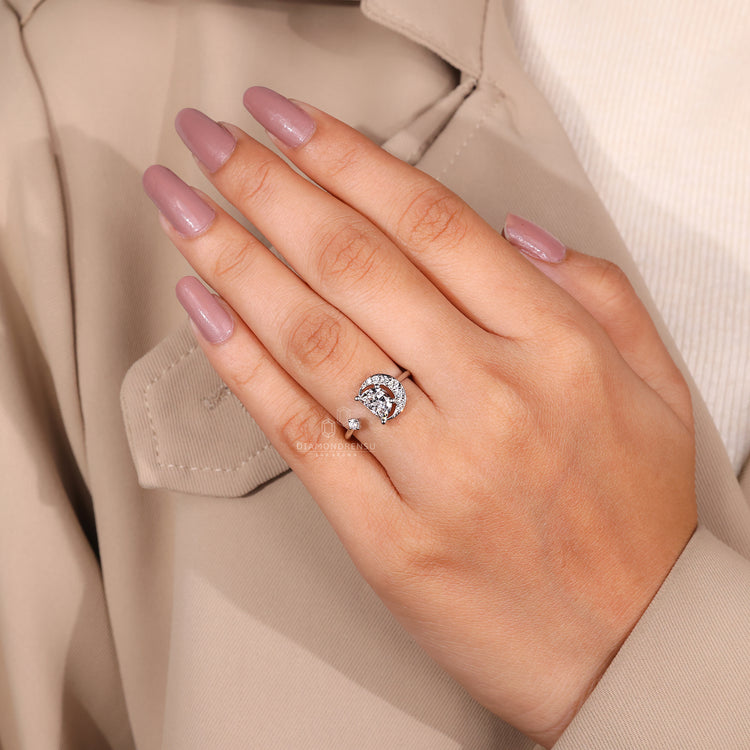 Handmade ring with round side stones and a prong setting.