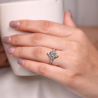 Seven stone ring featuring marquise and round side diamonds in yellow gold.