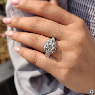 Elegant round moissanite ring in a vintage style, perfect for any engagement.