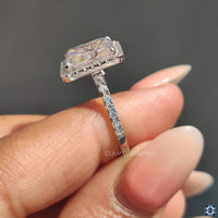 Halo ring with radiant cut moissanite for an eye-catching appearance.