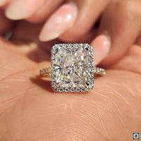 Elegant round moissanite engagement ring with a classic design.