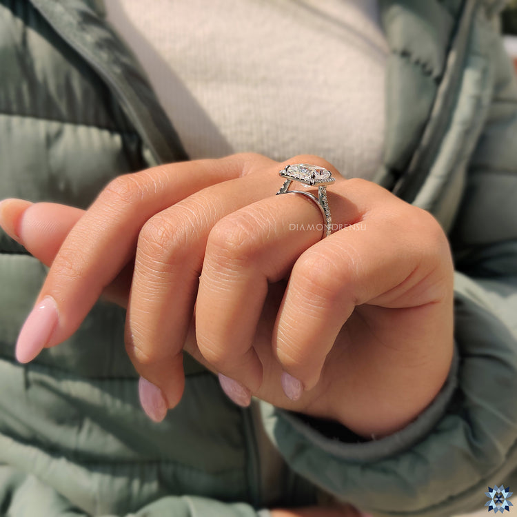 White gold jewellery ring showcasing a radiant cut moissanite centerpiece.