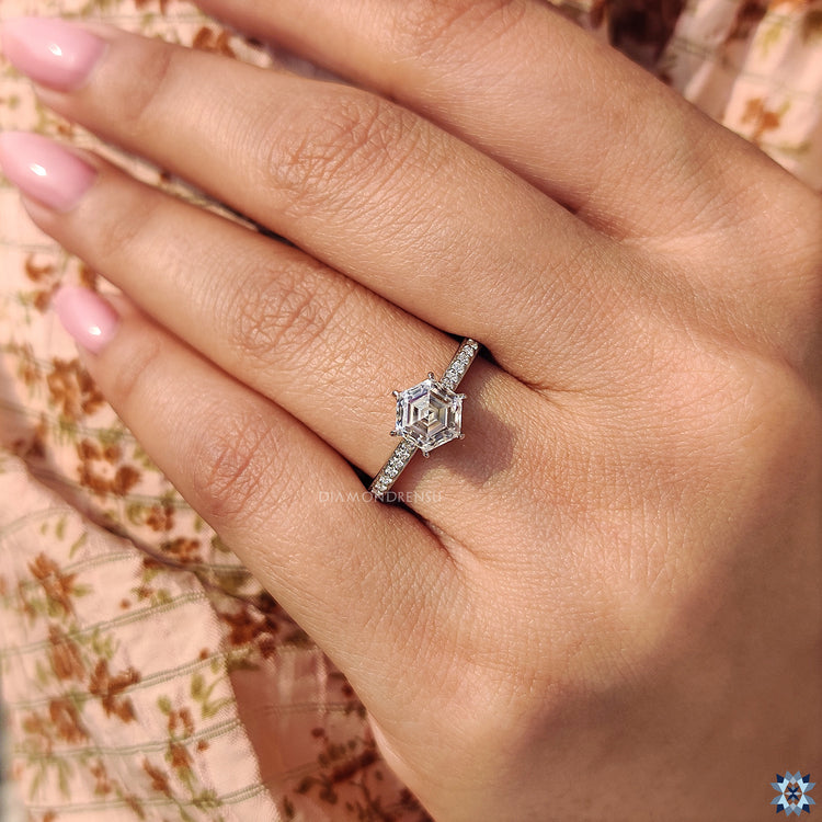 Handmade ring featuring a hexagon moissanite center for a unique design.