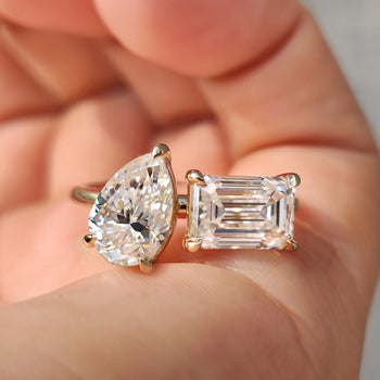 Elegant 2 stone engagement ring featuring a Pear and Emerald cut ring design in a claw prong setting.