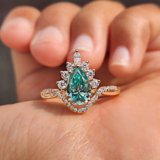 Chevron engagement ring with pear cut cyan blue moissanite