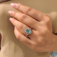 Round moissanite curved pave engagement ring with pear cut