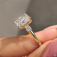 Yellow gold engagement ring with radiant center.