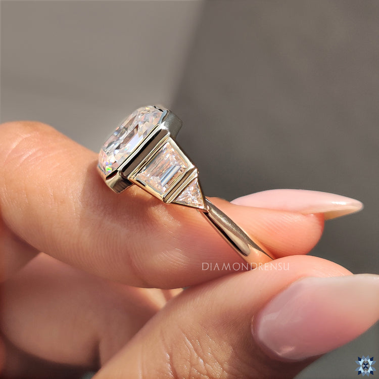Moissanite asscher cut ring with a bezel setting for added sparkle.