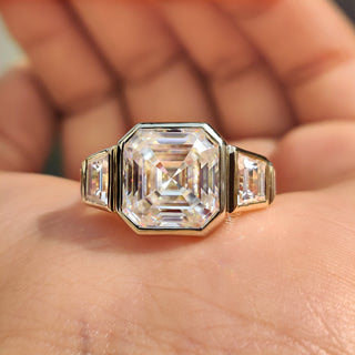 Asscher cut ring featuring a stunning asscher cut moissanite stone.