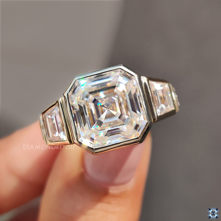 Bezel engagement ring with asscher cut diamond for secure brilliance.