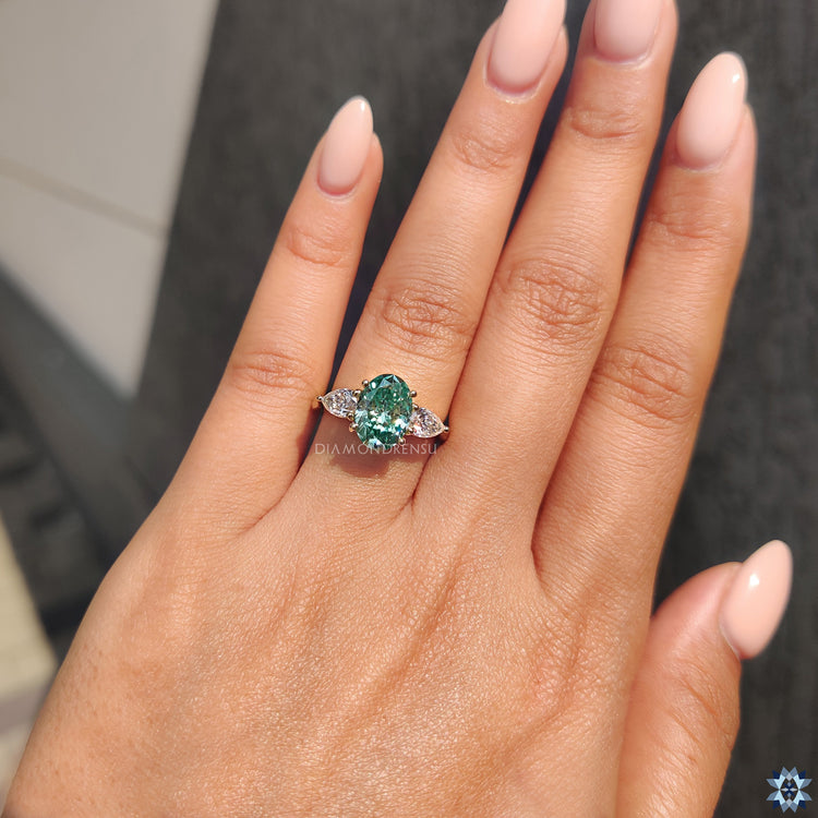 Moissanite pear side stones handmade jewelry three stone oval ring.