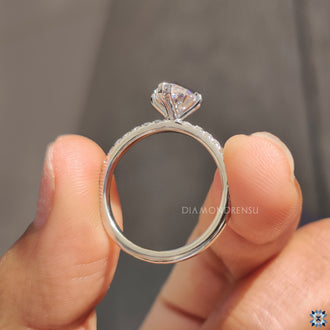 Buy Moissanite Ring with an elegant pear-shaped center stone.