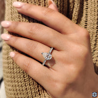 Prong Setting Ring with a pear-shaped moissanite stone.