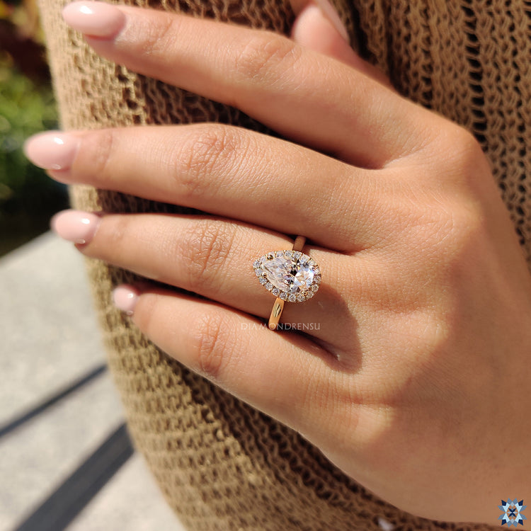 Halo Round Cut Moissanite creating an eye-catching, sparkling design.