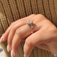 Hidden halo oval engagement ring with four claw prongs.