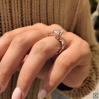 Rose gold engagement ring with nature-inspired details.