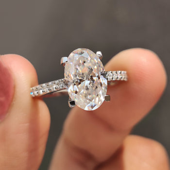 Oval cut moissanite ring with a sparkling finish.