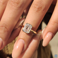 Stunning yellow gold moissanite ring with a classic touch.