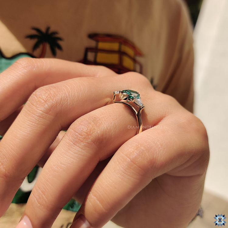 Yellow gold engagement ring with a radiant moissanite centerpiece.