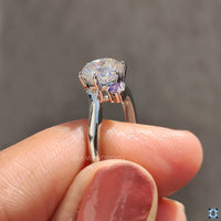 White gold moissanite ring with elegant shine.