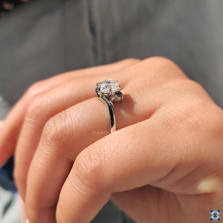 Purple moissanite center stone with vibrant hue.