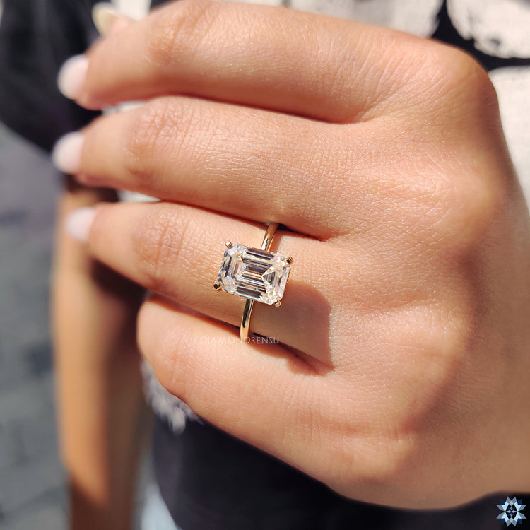 Solitaire ring featuring a single sparkling moissanite.