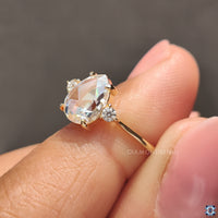 Three stone engagement ring with pear center.