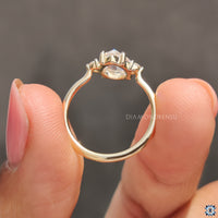 2 round cut side stone accent ring.