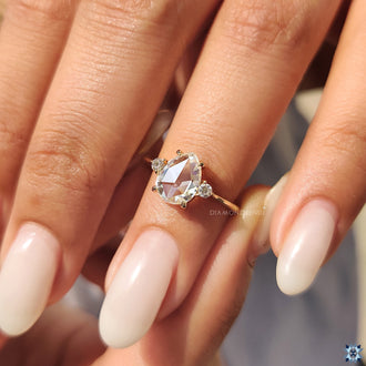 Handmade ring with pear moissanite center.