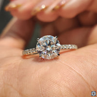 Round cut pave band ring crafted to enhance brilliance.